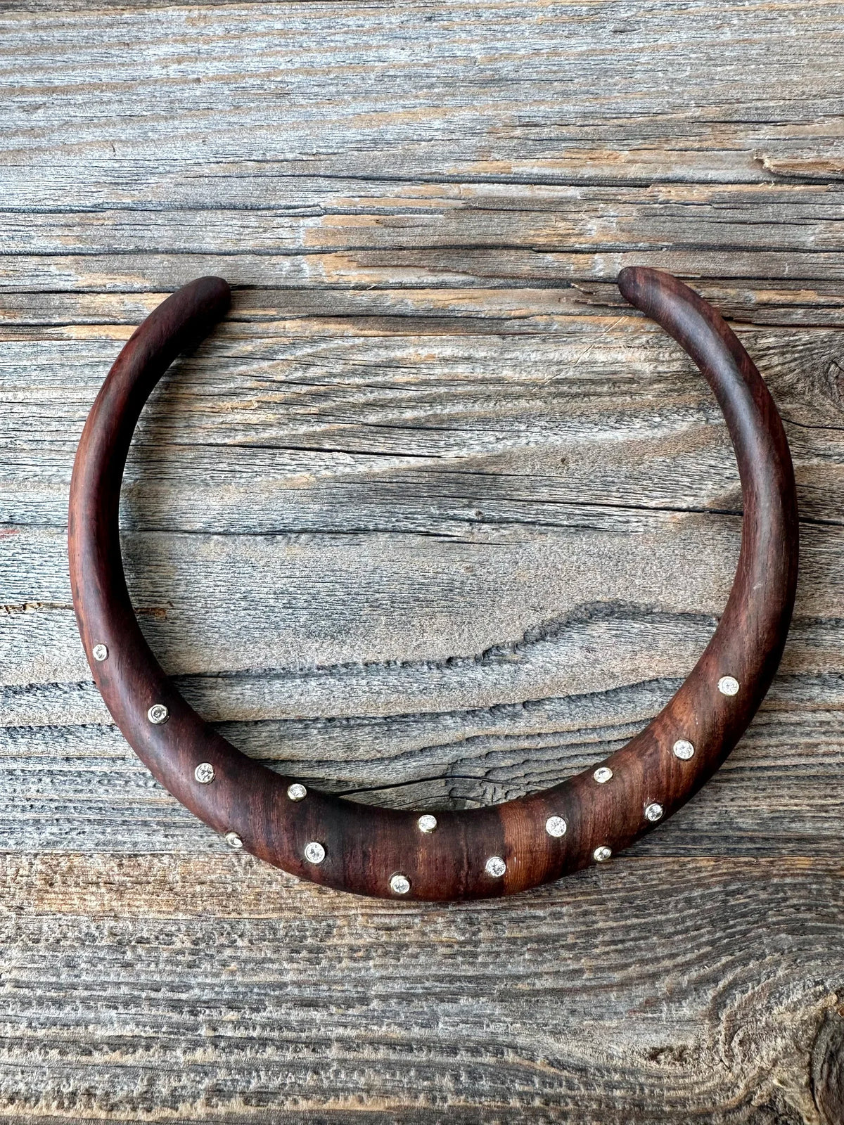 A cherry wood torque set with 15 round-cut diamonds.