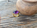 Large amethyst cabochon set within a 22KT mount, circa 1980s.