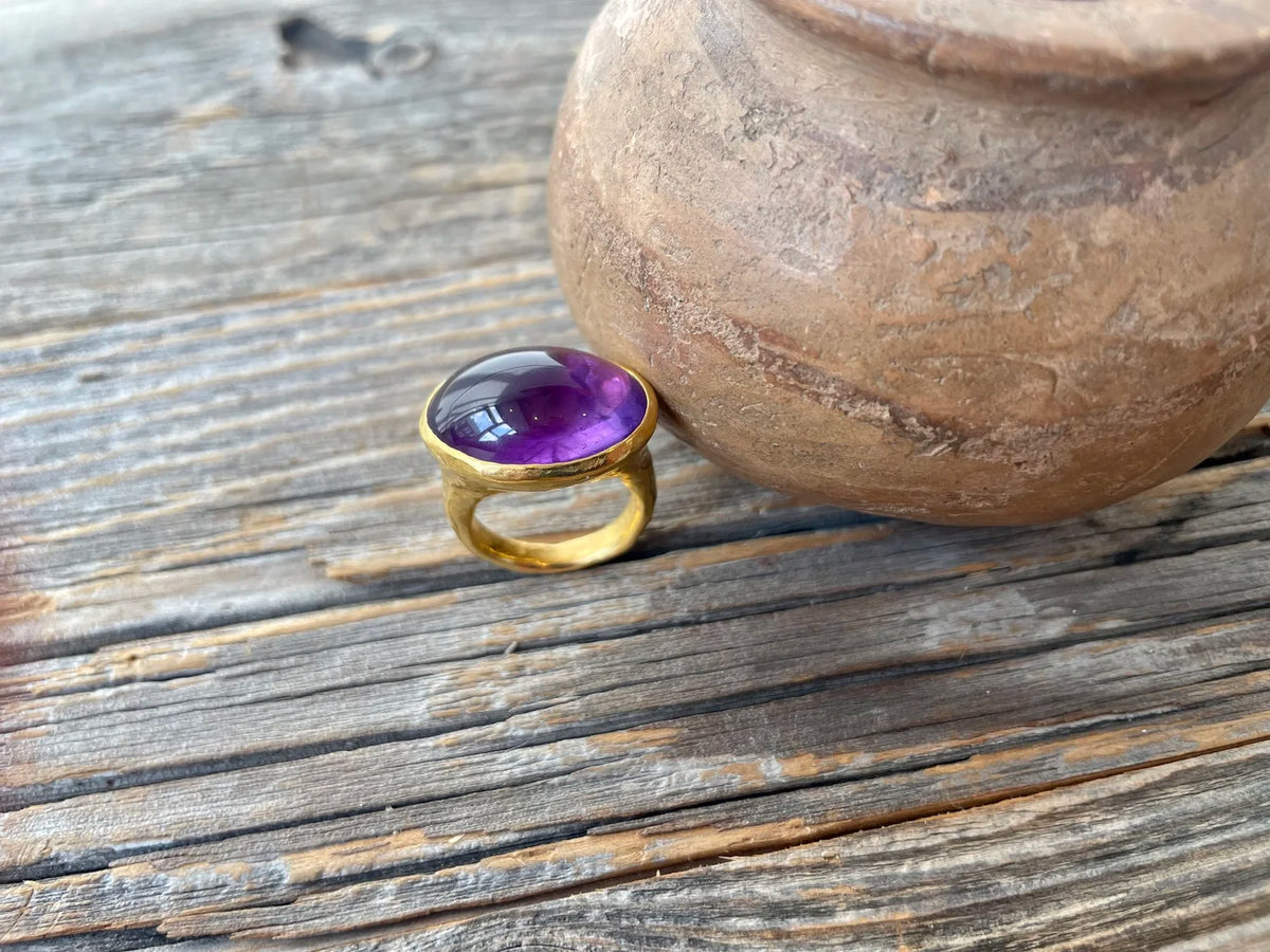 Large amethyst cabochon set within a 22KT mount, circa 1980s.