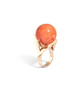An 18K gold and coral ball ring